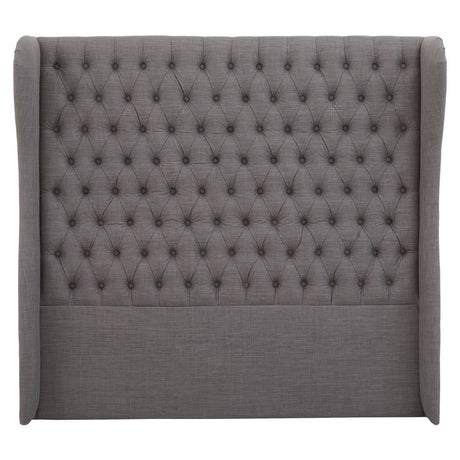 Kingsize headboard in a soft grey fabric featuring a tufted design with a high back and winged sides, providing a stylish and contemporary look for a bedroom