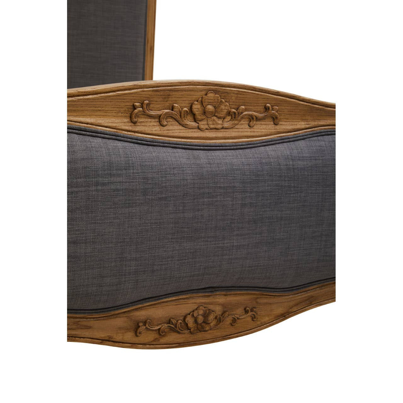 Grey fabric headboard with a curved wooden frame, featuring intricate carvings, designed for a super kingsize bed. The fabric has a textured appearance, complementing the warm tones of the wood