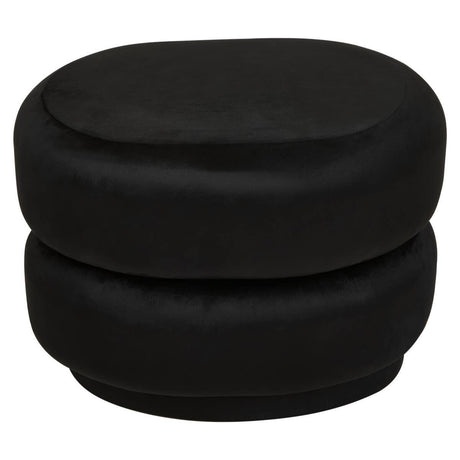 Black velvet oval pouffe with a smooth, plush surface and a rounded shape, featuring a stacked design that adds a modern touch to home decor