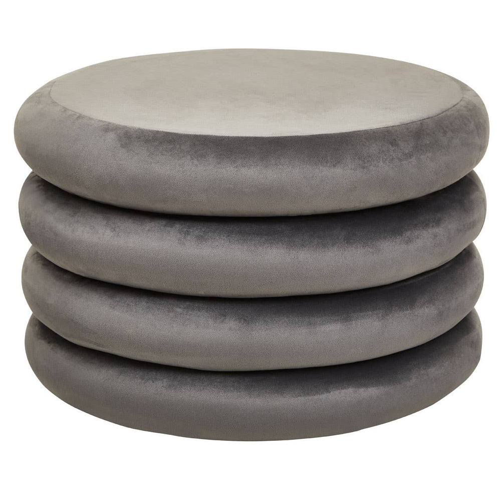 A stack of four round pouffes in a soft grey velvet fabric, featuring a smooth, plush surface and a minimalist design suitable for home decor