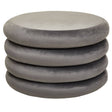 A stack of four round pouffes in a soft grey velvet fabric, featuring a smooth, plush surface and a minimalist design suitable for home decor