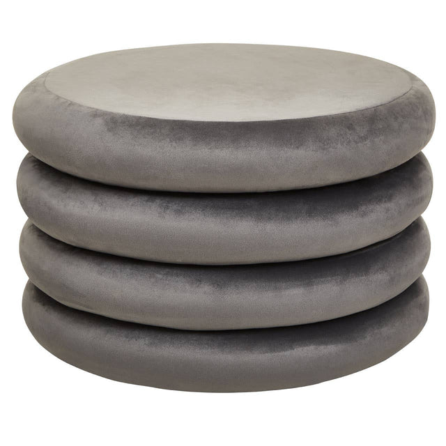 A stack of four round pouffes in a soft grey velvet fabric, featuring a smooth, plush surface and a minimalist design suitable for home decor