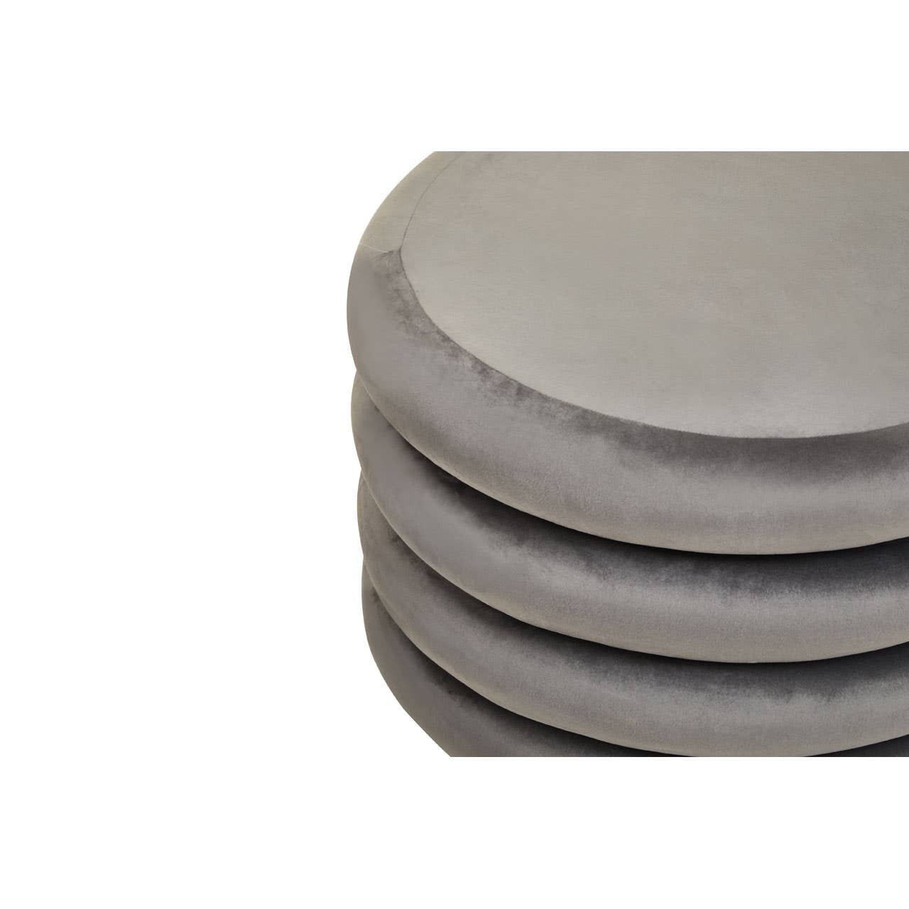 Soft grey velvet round pouffe with a smooth surface, featuring a slightly rounded top and a plush texture, stacked in a neat arrangement