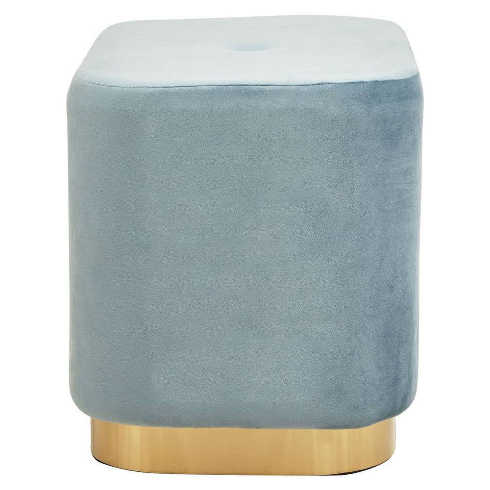 Rectangular pouffe upholstered in soft blue velvet with a matte gold base, featuring rounded corners and a smooth top surface