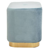 Rectangular pouffe upholstered in soft blue velvet with a matte gold base, featuring rounded corners and a smooth top surface