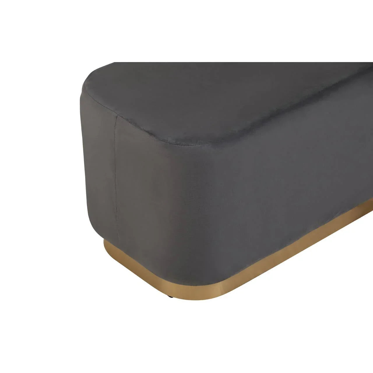 Closeup of grey fabric sofa corner with gold metal base
