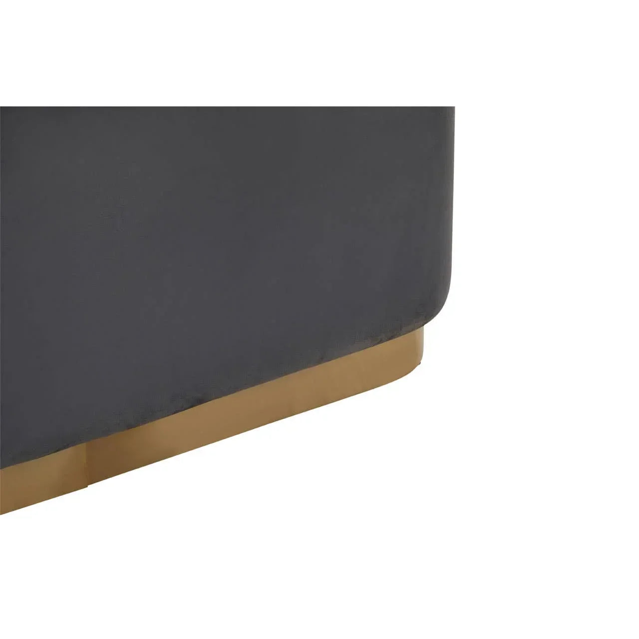 Grey velvet sofa corner with gold metal base detail