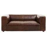Antique brown leather two-seater sofa with a minimalist design, featuring wide armrests and a low back, resting on short wooden legs. The leather has a rich texture and subtle sheen, showcasing its vintage appeal