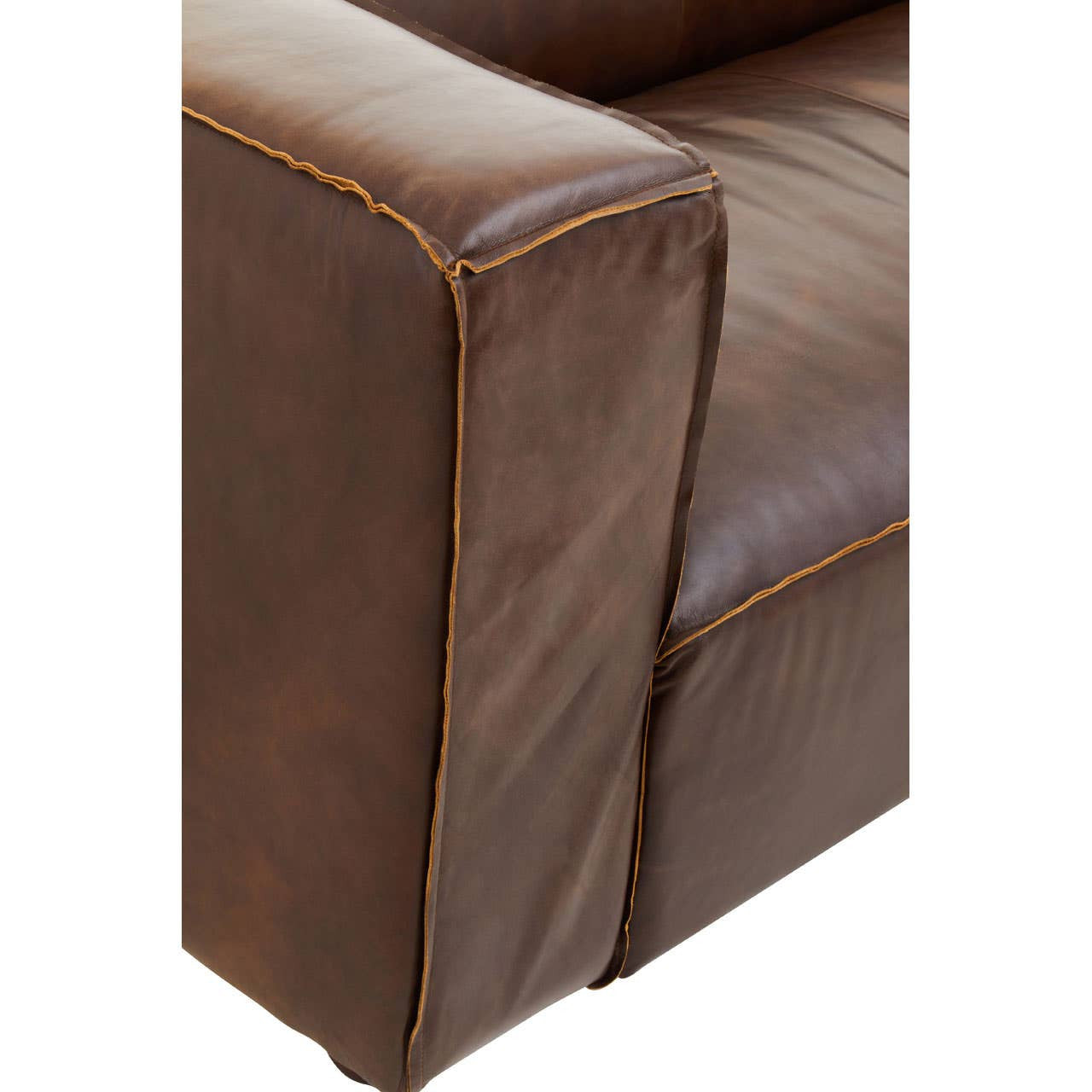 Close-up view of the corner of a King Two Seater Antique Brown Leather Sofa, showcasing the rich, textured brown leather and contrasting stitching along the edges. The armrest is prominently displayed, highlighting the sofa's sturdy construction and vintage appeal