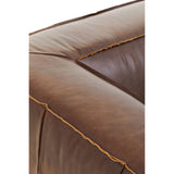 Close-up view of the corner of a King Two Seater Antique Brown Leather Sofa, showcasing the rich, textured brown leather and contrasting stitching along the edges. The sofa features a square, padded design with visible seams, emphasizing its vintage style and craftsmanship