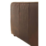 Antique brown leather sofa with a smooth, textured surface and subtle stitching details, showcasing a sleek, modern design. The image focuses on the side view, highlighting the sofa's clean lines and sturdy construction