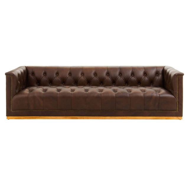 A modern three-seater Chesterfield sofa in dark brown leather, featuring a tufted backrest and sleek armrests. The sofa has a low profile and a sturdy wooden base, showcasing a classic yet contemporary design suitable for various living spaces