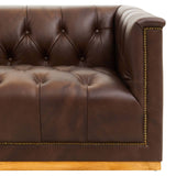 Dark brown leather Chesterfield sofa featuring a tufted design, elegant gold trim along the edges, and a sturdy wooden base. The sofa has a modern aesthetic with a three-seater capacity and plush cushioning for comfort