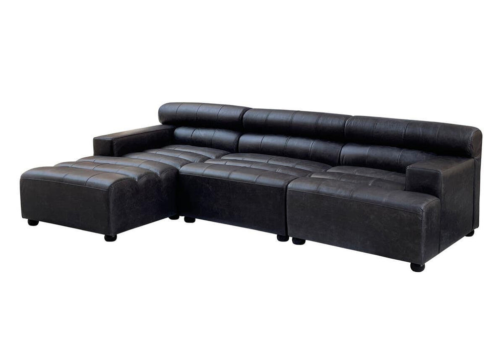 Antique black leather modular sofa chair with a sleek design, featuring no armrests and a low backrest. The sofa has a sectional layout with a chaise lounge on one side, supported by short, sturdy legs. The leather upholstery has a smooth finish, showcasing a modern yet classic aesthetic suitable for various interior styles