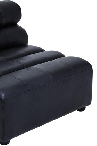 Antique black leather modular sofa chair with a sleek, armless design featuring smooth, rounded edges and a plush, cushioned seat. The chair has a contemporary look with horizontal stitching on the backrest and sits on short, sturdy legs