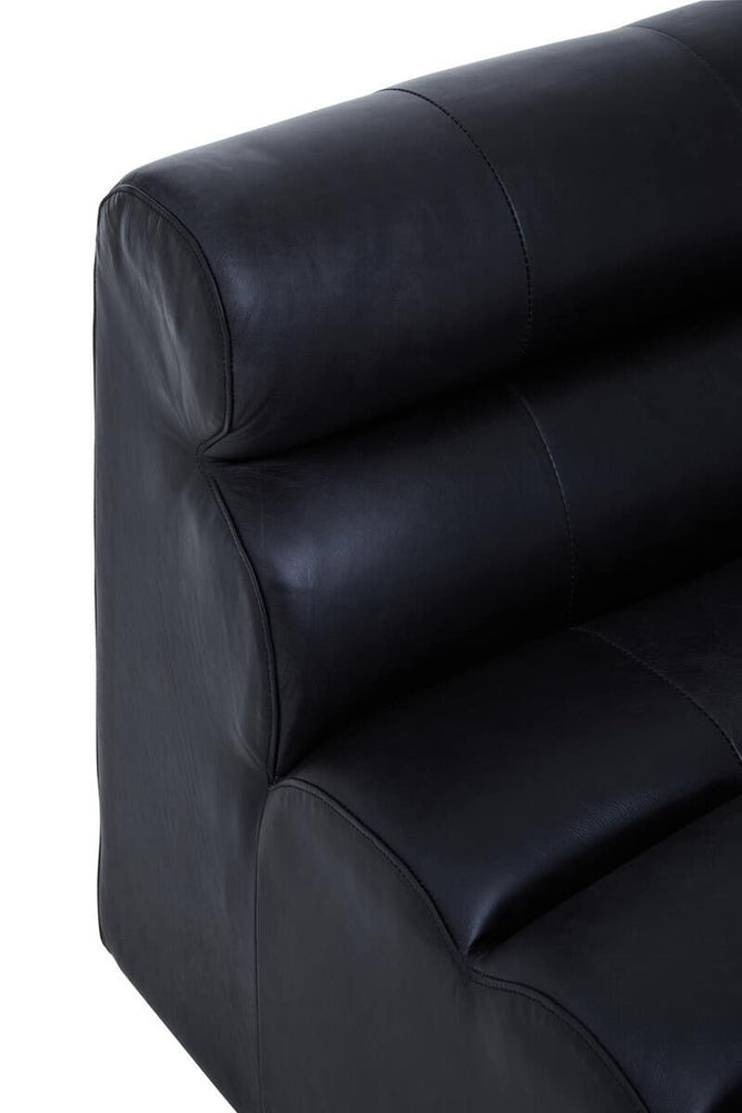 Close-up view of a king armless modular sofa chair featuring antique black leather upholstery, showcasing a smooth surface with subtle texture and three horizontal padded sections on the backrest for added comfort