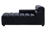 Left arm chaise sofa in antique black leather with a sleek, modern design. The sofa features a low backrest and a series of horizontal tufted sections along the seating area. The legs are short and rounded, providing stability and a contemporary look
