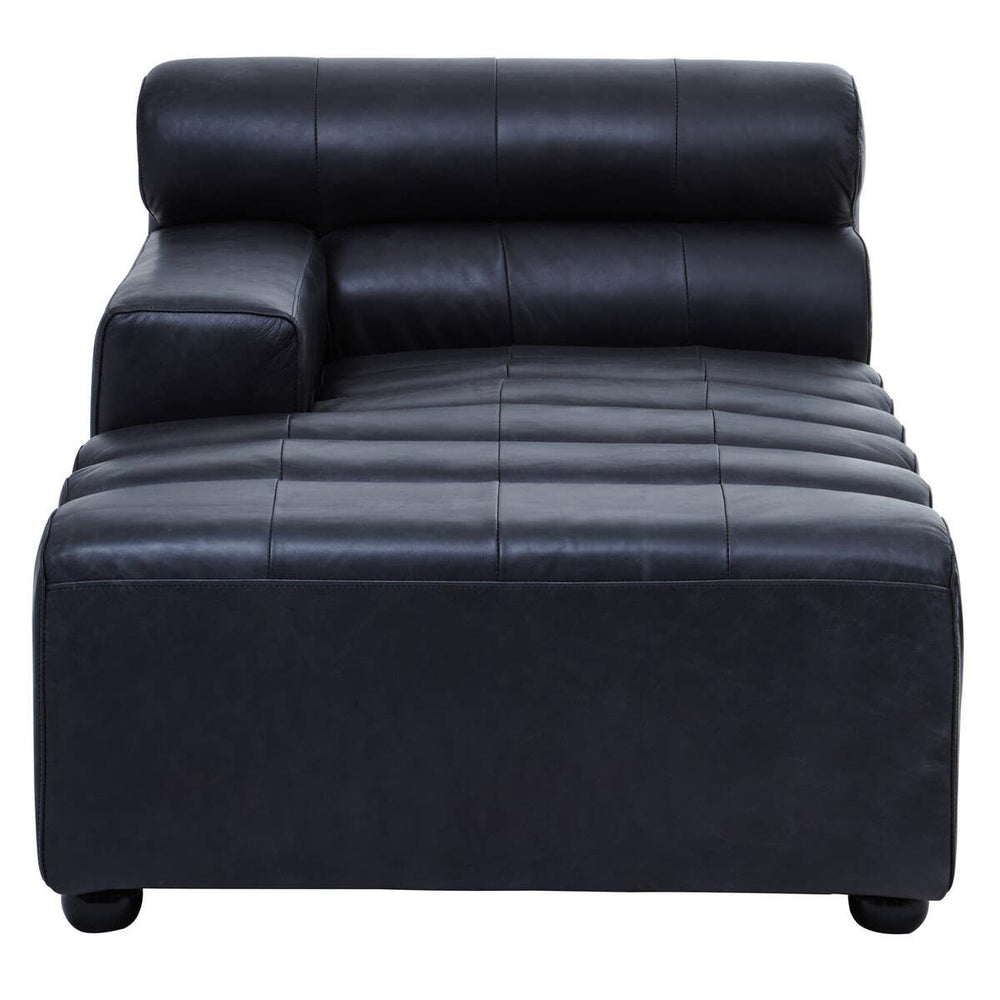 Left arm chaise sofa in antique black leather, featuring a sleek design with a low backrest and a rolled cushion. The seat has horizontal stitching for added texture, and the legs are short and rounded, providing stability