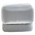 Square stool upholstered in soft grey velvet with a smooth, rounded top and clean lines, featuring a minimalist design that complements modern home decor