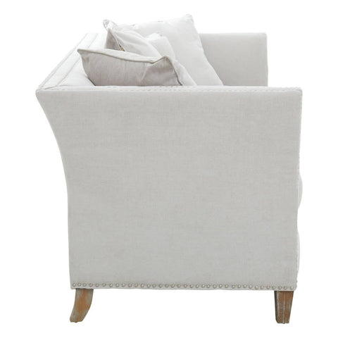 Three-seat sofa upholstered in grey fabric with a modern design, featuring clean lines and a slightly curved back. The sofa has two decorative cushions and wooden legs, showcasing a minimalist aesthetic suitable for contemporary living spaces