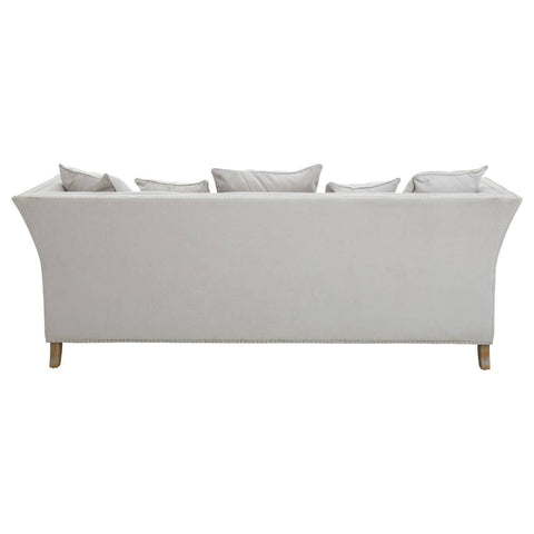 Three-seat sofa upholstered in grey fabric with a sleek, modern design, featuring a curved back and four decorative cushions on the seat. The sofa stands on light wooden legs, showcasing a minimalist aesthetic suitable for contemporary living spaces