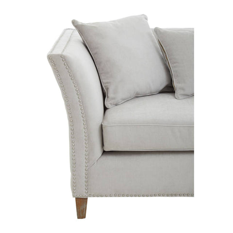 Three-seat sofa in grey fabric featuring a curved armrest and plush cushions, supported by wooden legs. The design is modern and inviting, suitable for various living room styles