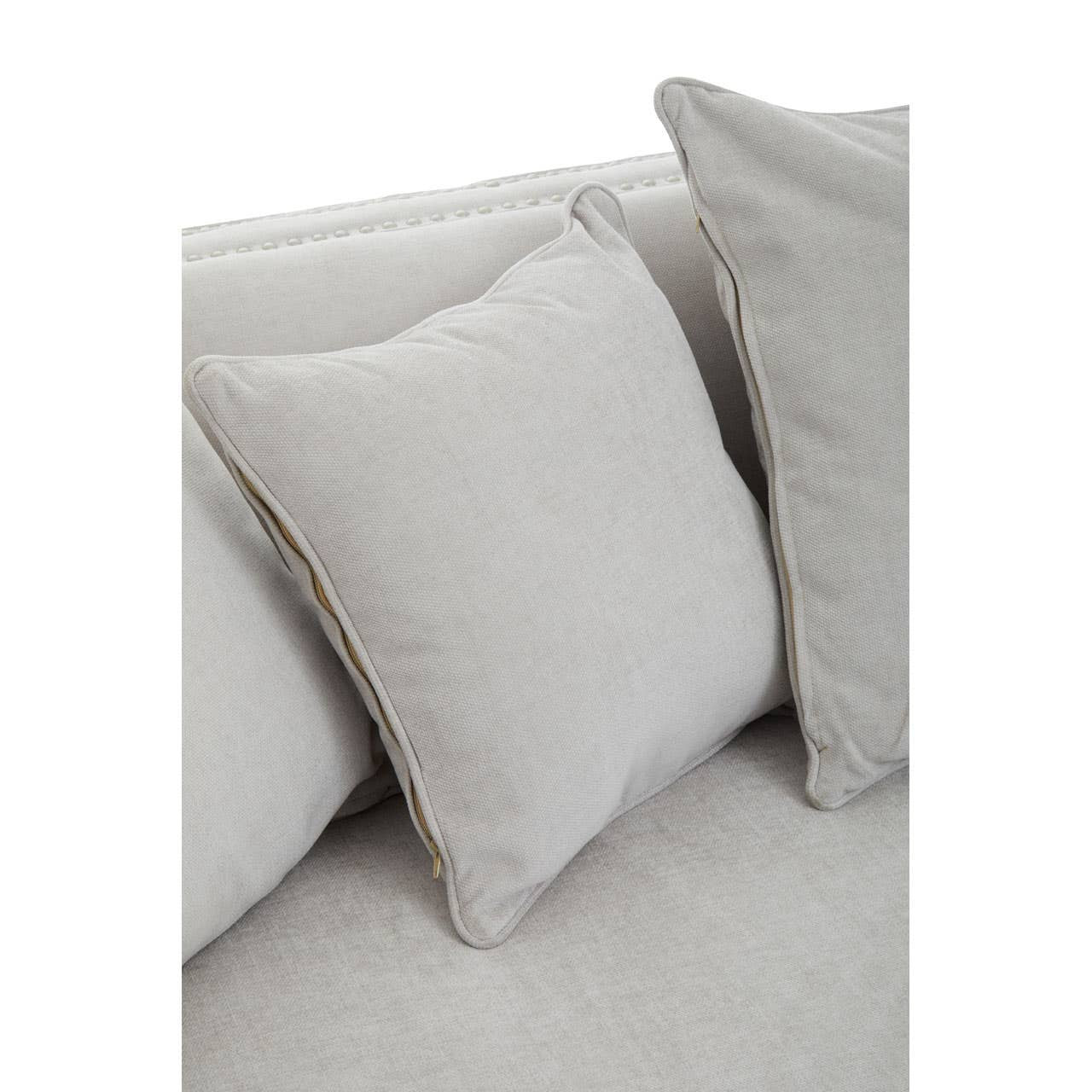 Three-seat sofa upholstered in light grey fabric, featuring two plush back cushions that match the sofa's color, showcasing a modern and minimalist design