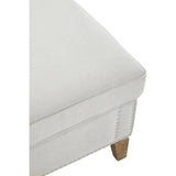 Grey fabric footstool with a soft, cushioned top and wooden legs, showcasing a clean and modern design