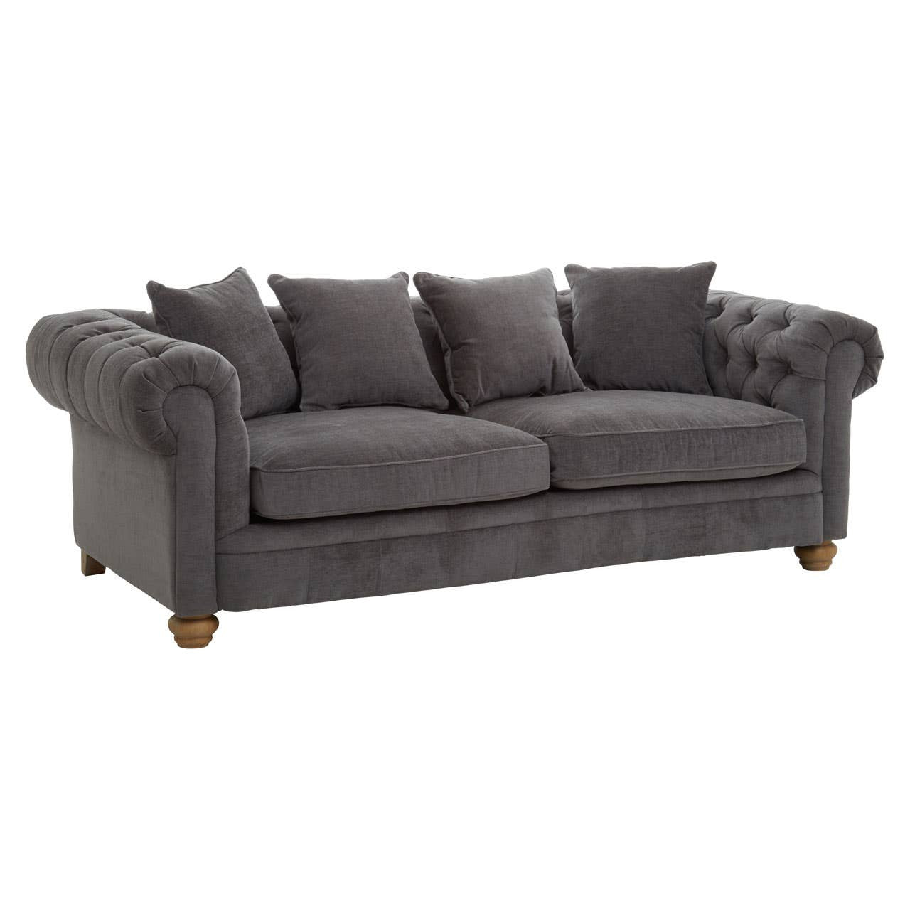 Three-seat sofa upholstered in grey fabric featuring a tufted backrest and rolled arms, complemented by four matching throw pillows and wooden legs