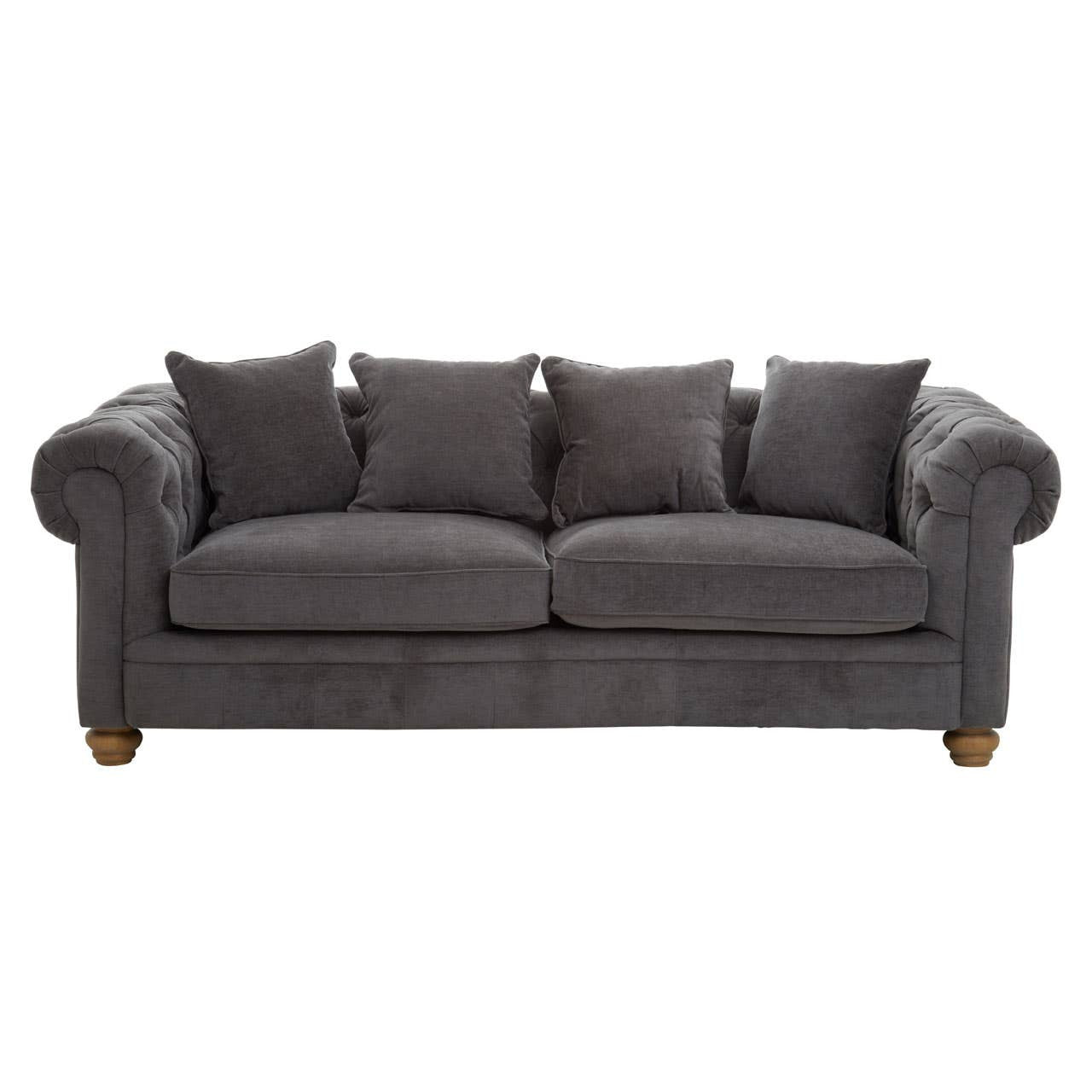 Three-seat sofa upholstered in grey fabric, featuring a classic design with rolled arms and four matching cushions. The sofa rests on wooden legs, showcasing a sturdy and elegant appearance suitable for various living spaces