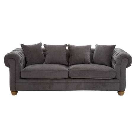 Three-seat sofa upholstered in grey fabric, featuring a classic design with rolled arms and four matching cushions. The sofa rests on wooden legs, showcasing a sturdy and elegant appearance suitable for various living spaces
