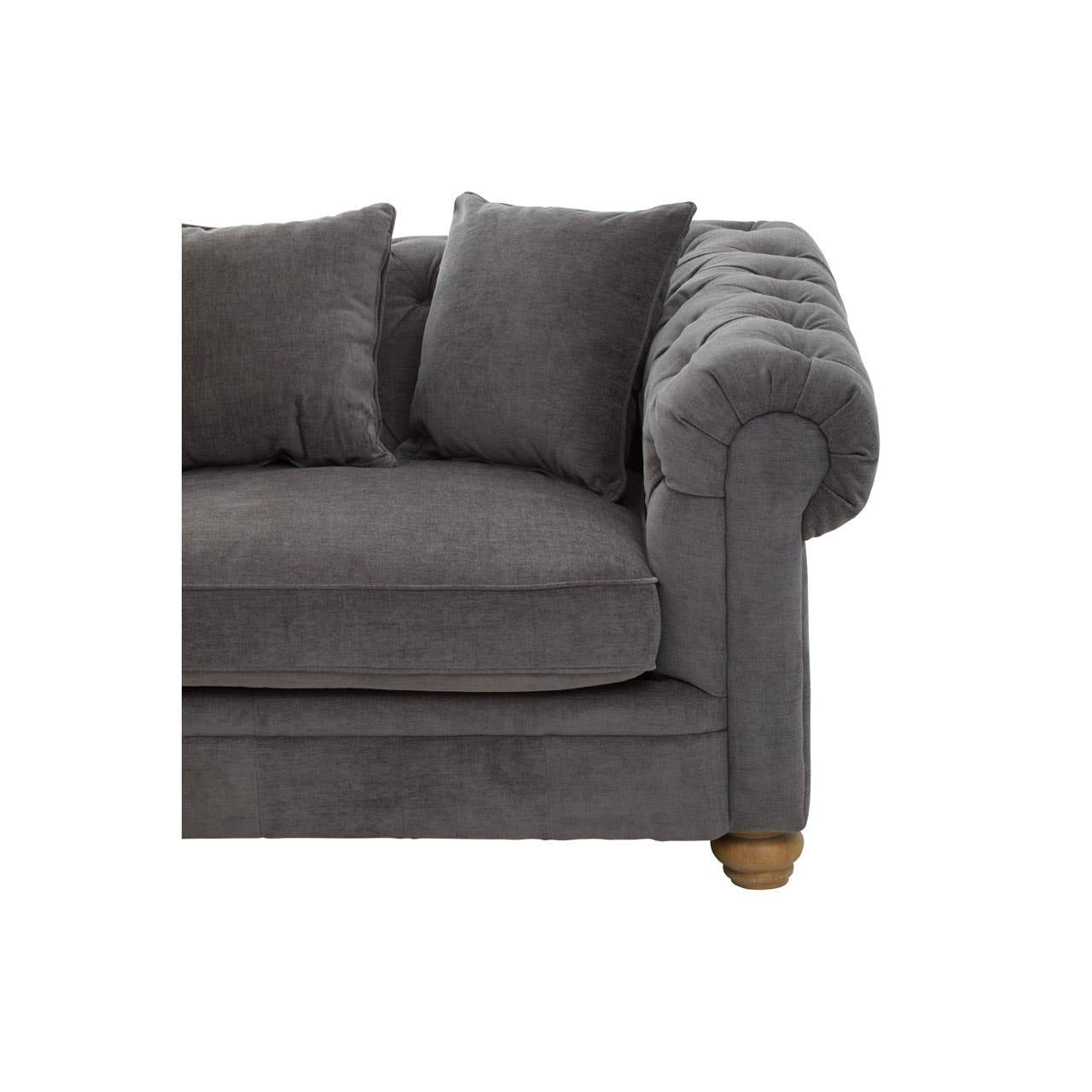 Three-seat sofa upholstered in grey fabric, featuring plush cushions and a rolled arm design. The sofa rests on wooden legs, showcasing a classic and comfortable style suitable for home decor