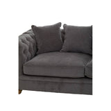 Three-seat grey fabric sofa featuring a tufted design on the armrest and back, with two plush cushions for added comfort. The sofa has wooden legs and a modern aesthetic suitable for various home decor styles