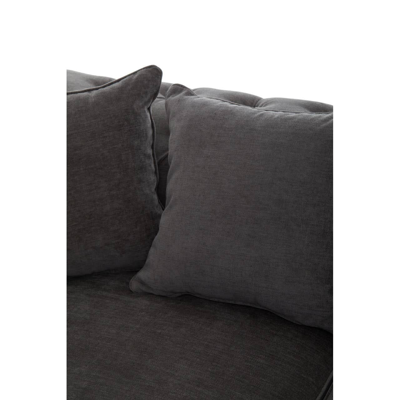 Grey fabric sofa with three seats, featuring plush cushions and a modern design. The sofa has a soft texture and is shown with two decorative pillows on one side