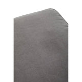 Soft grey fabric footstool with a rounded corner, showcasing a smooth texture and subtle sheen