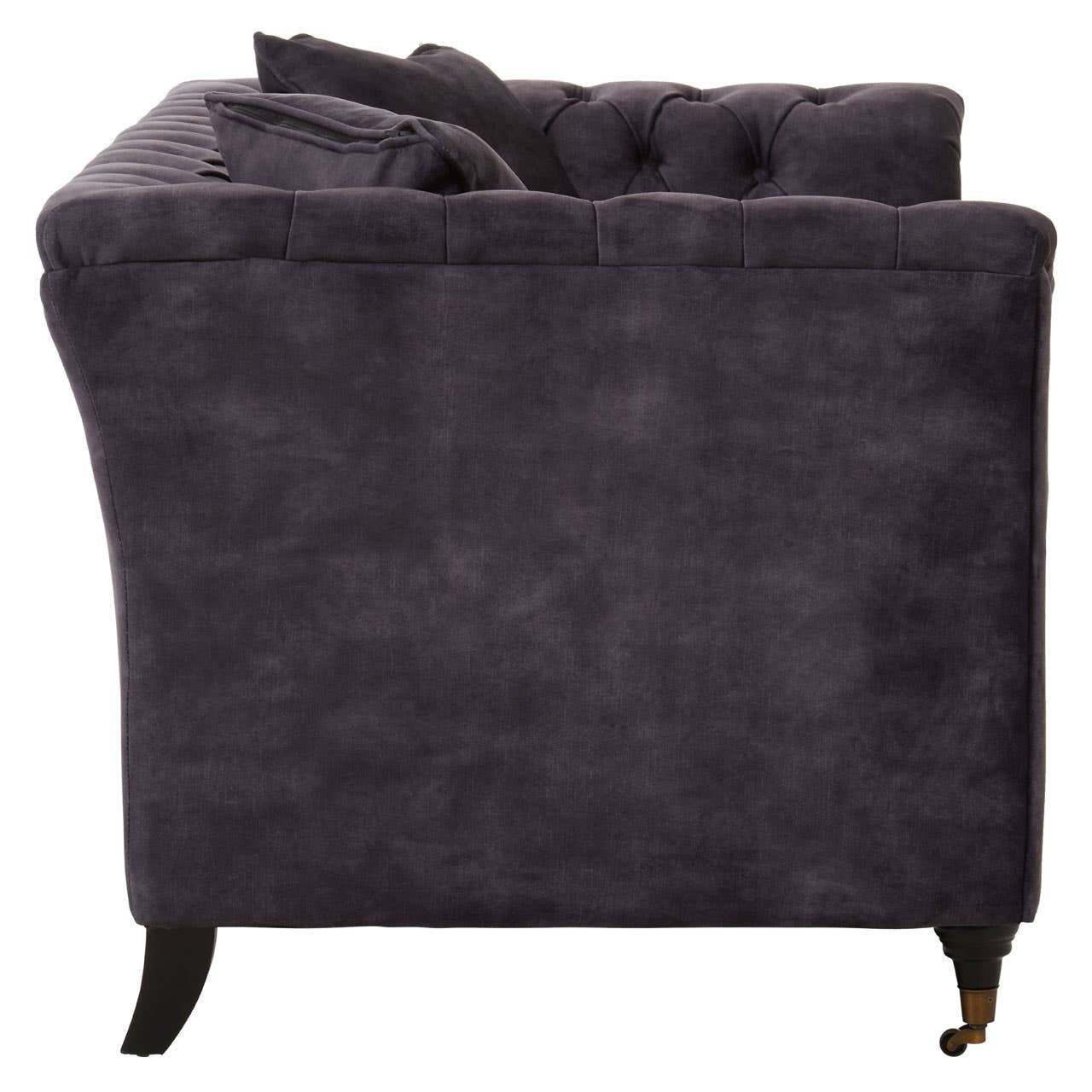 Grey velvet two-seat sofa with a tufted backrest, plush cushions, and dark wooden legs, showcasing a sleek and modern design