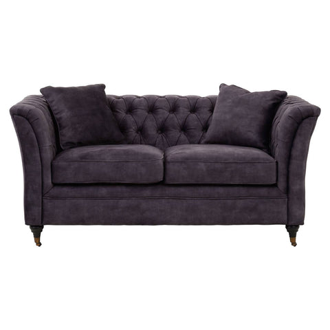 Two-seat grey velvet sofa with tufted backrest, plush cushions, and elegant curved arms, resting on wooden legs