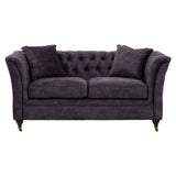 Two-seat grey velvet sofa with tufted backrest, plush cushions, and elegant curved arms, resting on wooden legs