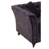 Grey velvet two-seat sofa featuring a curved armrest and plush upholstery, with wooden legs providing support. The fabric has a soft texture, and there are decorative cushions on the seat