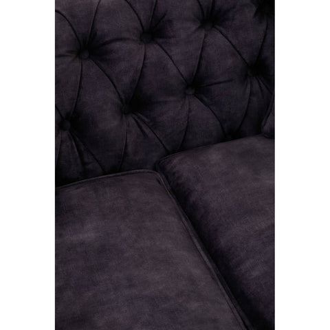 Grey velvet sofa with a tufted backrest and plush cushions, designed for two seats, showcasing a soft texture and elegant appearance
