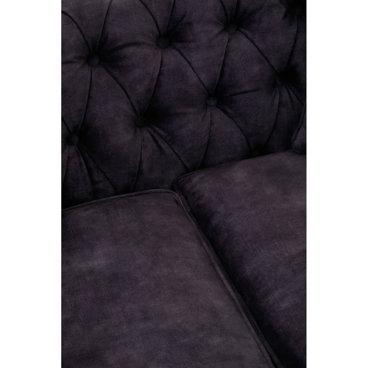 Grey velvet sofa with a tufted backrest and plush cushions, designed for two seats, showcasing a soft texture and elegant appearance
