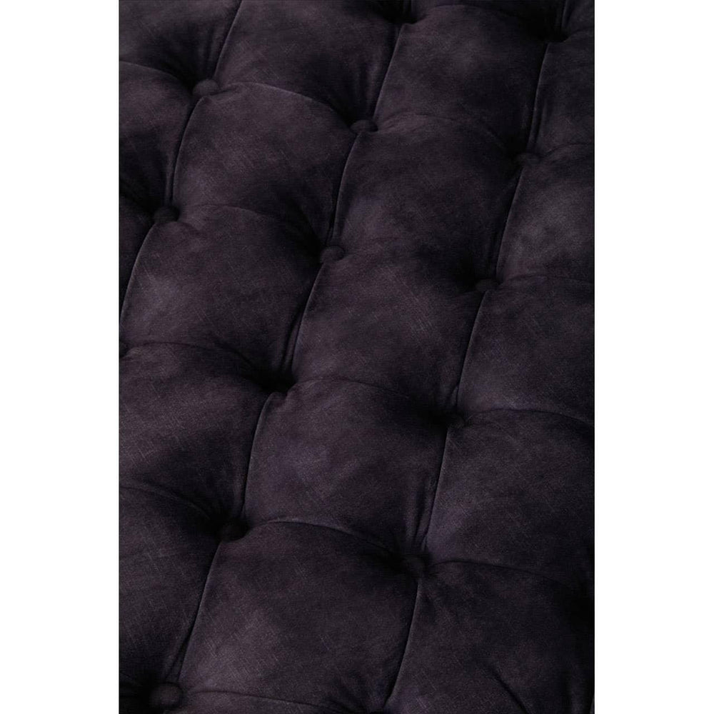 Close-up of dark grey tufted sofa upholstery fabric with soft velvety texture