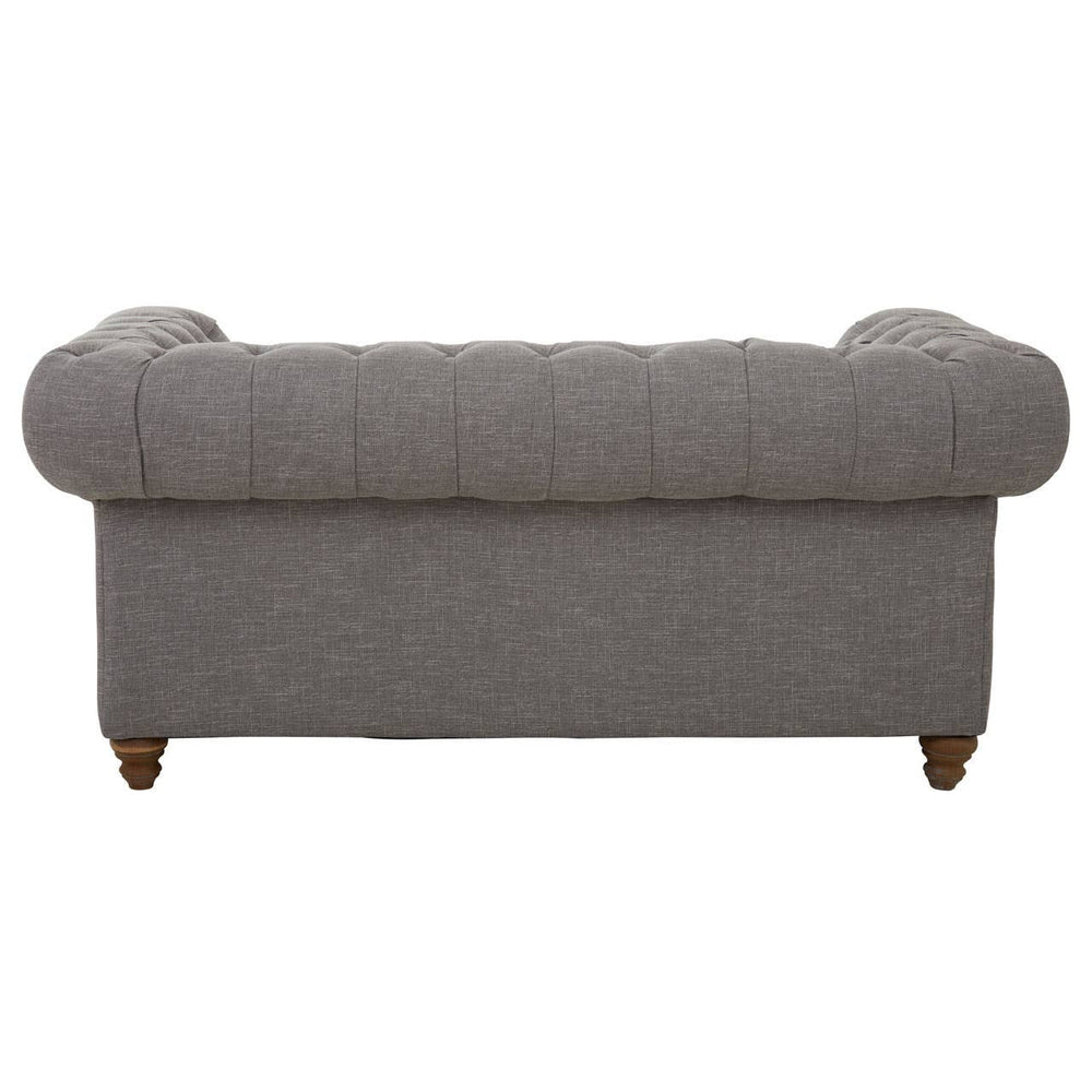Grey linen two-seat sofa with a tufted backrest and rounded armrests, resting on wooden legs. The fabric has a soft texture, and the overall design is modern and minimalist