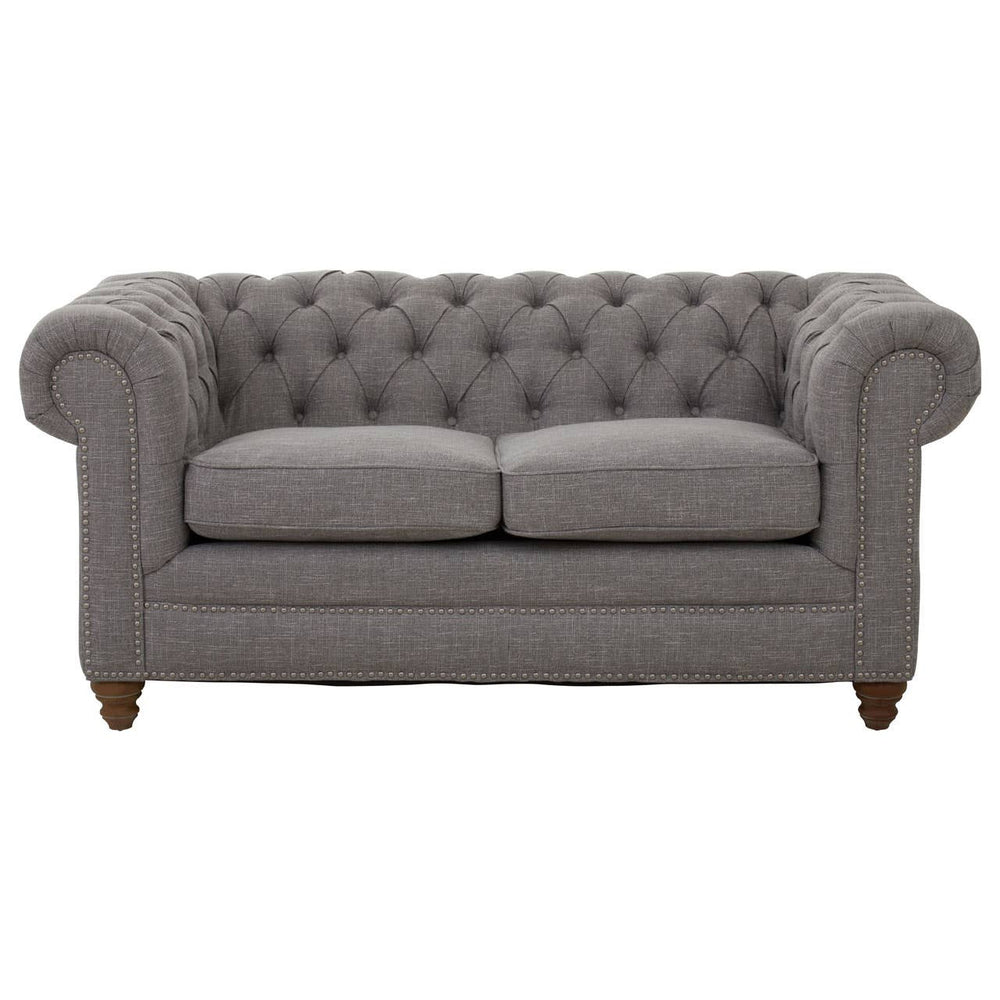 Two-seat sofa upholstered in grey linen with a tufted backrest and rolled arms, featuring wooden legs. The cushions are plush and inviting, designed for comfort and style