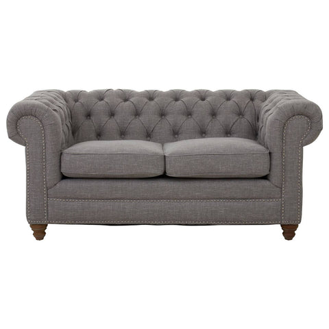 Two-seat sofa upholstered in grey linen with a tufted backrest and rolled arms, featuring wooden legs. The cushions are plush and inviting, designed for comfort and style