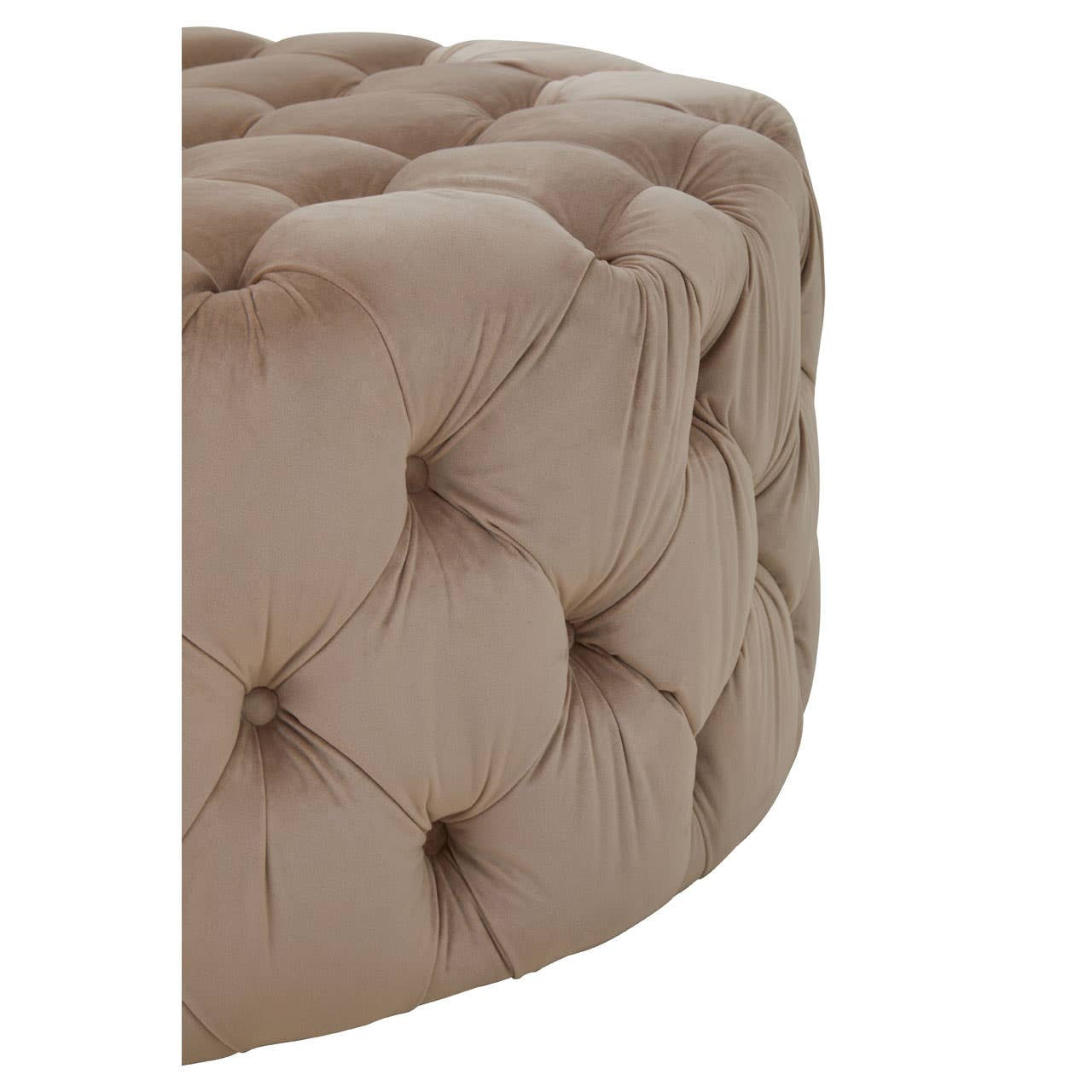 Beige velvet round ottoman stool with tufted detailing, showcasing a soft, plush texture and a rounded shape. The corner of the stool is visible, highlighting its elegant design and neutral color