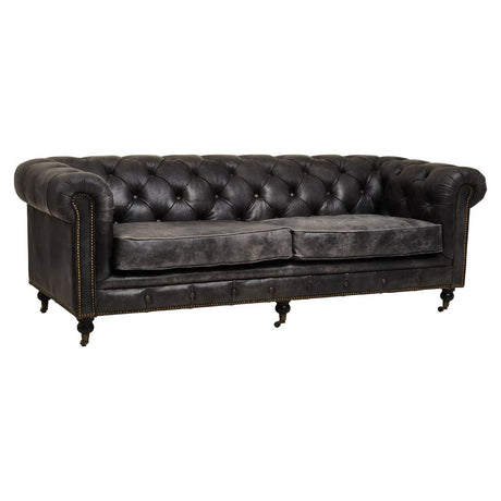 Antique black Chesterfield leather sofa with three seats, featuring tufted backrest and armrests, wooden legs, and a classic design