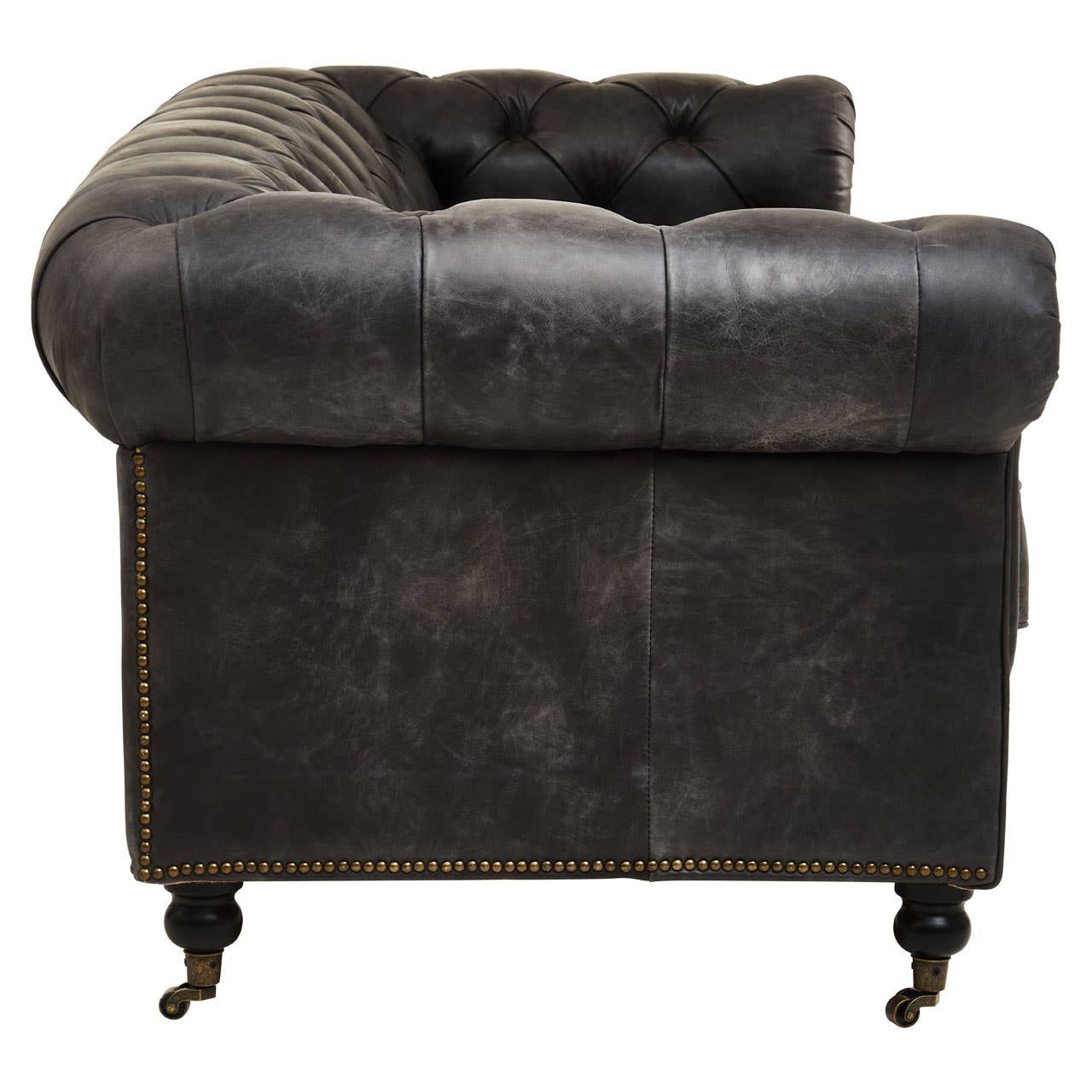 Antique black Chesterfield leather sofa featuring a tufted backrest, rolled arms, and elegant wooden legs with casters. The sofa has a classic design with a deep seat and plush upholstery, showcasing a vintage aesthetic