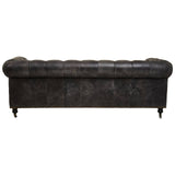 Antique black Chesterfield leather sofa featuring a classic tufted backrest and rolled arms, supported by elegant wooden legs. The sofa is designed for three seats, showcasing a vintage aesthetic with a rich texture