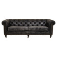 Antique black leather Chesterfield sofa featuring a classic tufted design, three spacious seats, and rolled arms, supported by elegant wooden legs